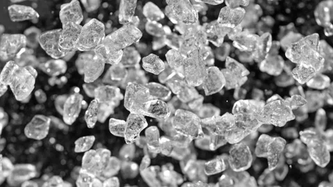 Super slow motion of rotating crushed ice on black background. Stock Footage 243021165