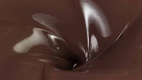 Super slow motion of rotating dark hot chocolate. Stock Footage 141056100