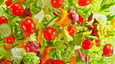 Super slow motion of rotating fresh lettuce flying up in the air Stock Footage 239430322