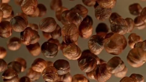 Super slow motion of rotating hazelnuts up to the air. Stock Footage 237168058