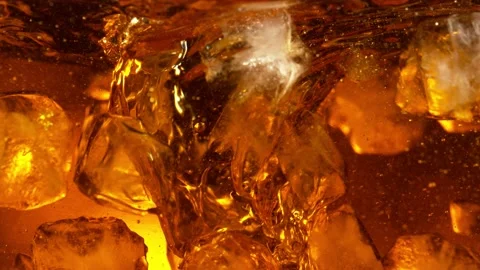 Super slow motion of rotating ice cubes ... | Stock Video | Pond5