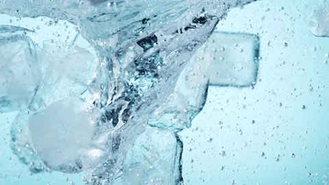 Super slow motion of rotating ice cubes in the  water. Stock Footage 148166642