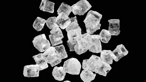 Super slow motion of rotating ice cubes on black, top view shot Stock Footage 171804450