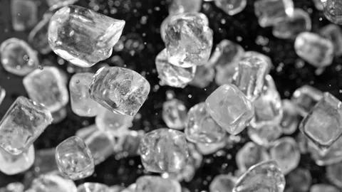 Super slow motion of rotating ice cubes, top view shot. Stock Footage 239431640