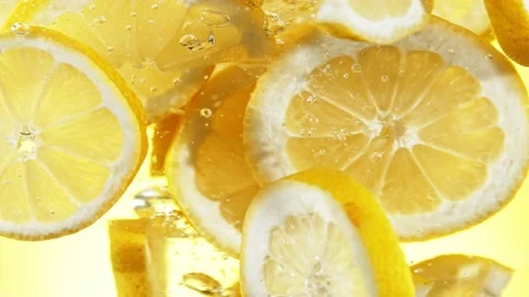 Super slow motion of rotating lemon slices underwater. Stock Footage 193321227