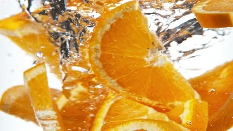 Super slow motion of rotating orange slices underwater. Stock Footage 193180266