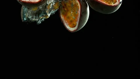 Super slow motion of rotating passion fruit underwater. Stock Footage 212008051