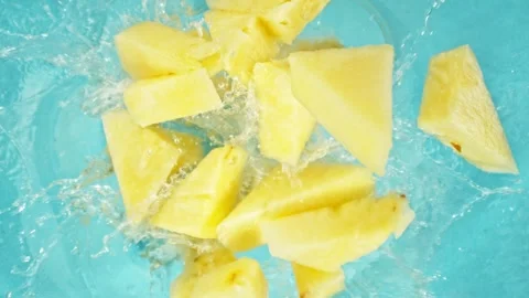 Super slow motion of rotating pineapple slices, top view. Stock Footage 280255917