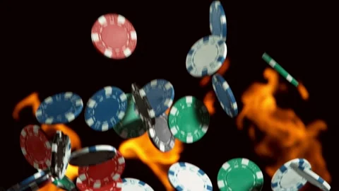 Super slow motion of rotating poker chips with flames on background Stock Footage 130486573