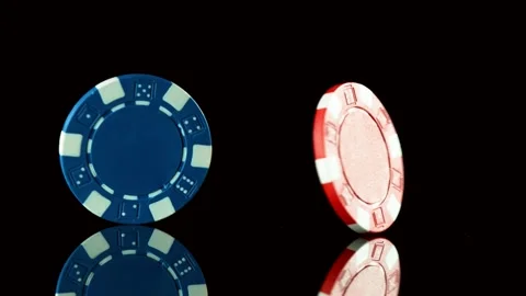 Super slow motion of rotating poker chips on black table. Stock Footage 130641278