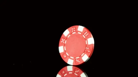 Super slow motion of rotating poker chips on black table. Stock Footage 130641326