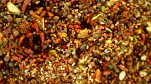 Super slow motion of rotating spices mix on black background. Stock Footage 239248595