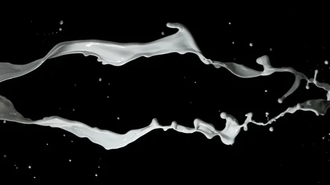 Super slow motion of rotating two milk splashes on black background. Stock Footage 112653047