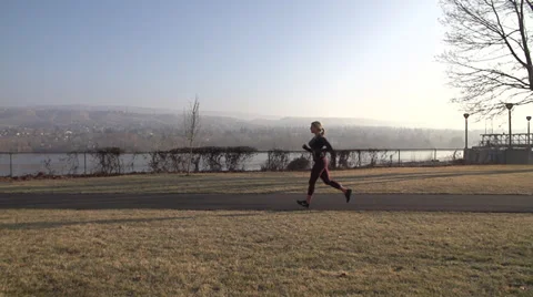 Super slow motion running through park Stock Footage 33689713