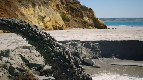 Super slow motion of sand being pumped onto beach to comabt erosion. Stock Footage 92332615