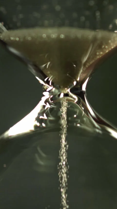 Super slow motion sand fall in the hourglass. Filmed on a high-speed camera at Stock Footage 335366375