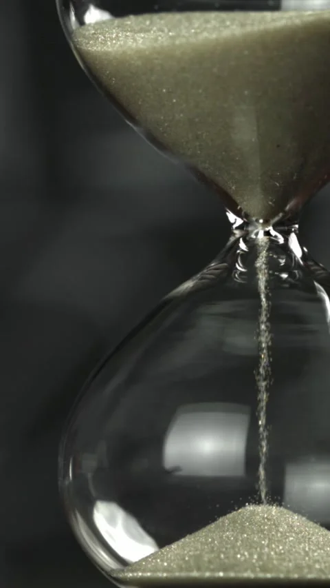 Super slow motion sand fall in the hourglass. Filmed on a high-speed camera at Stock Footage 335373858