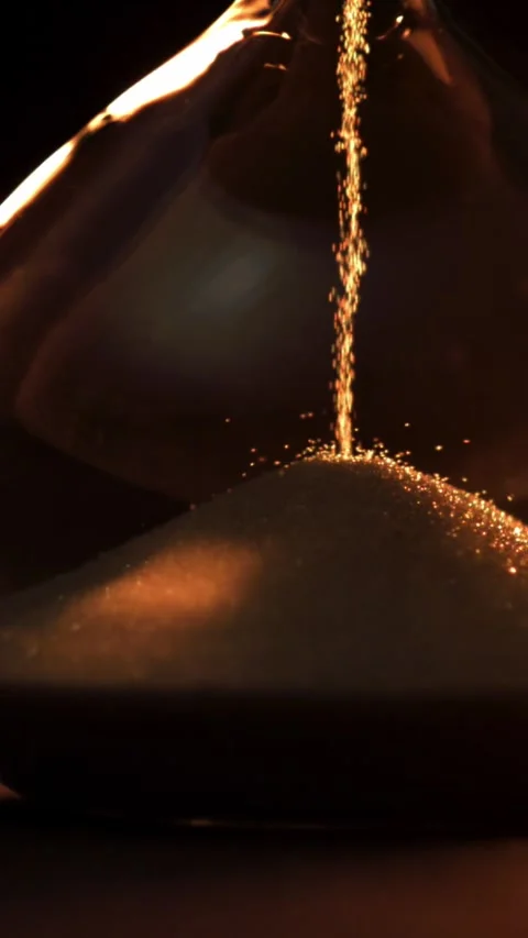 Super slow motion sand fall in the hourglass. Filmed on a high-speed camera at Stock Footage 335374581