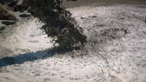 Super slow motion of sand landing on beach reclamation area. Stock Footage 92337760