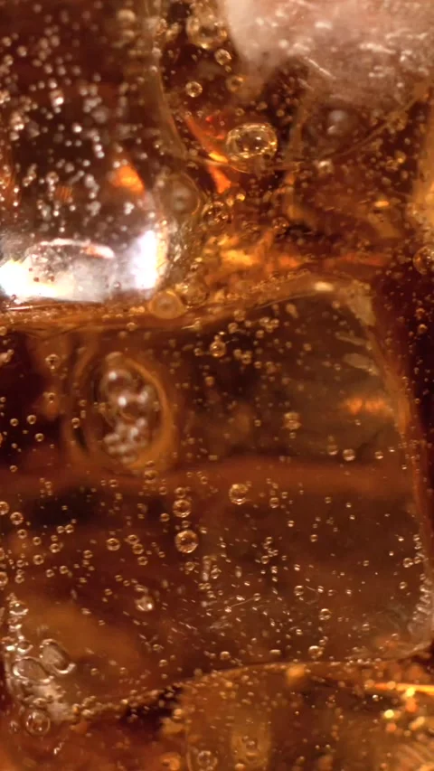 Super slow motion, Scientist Examines Fizz In Drink Bubbling Ice Macro Stock Footage 330110978