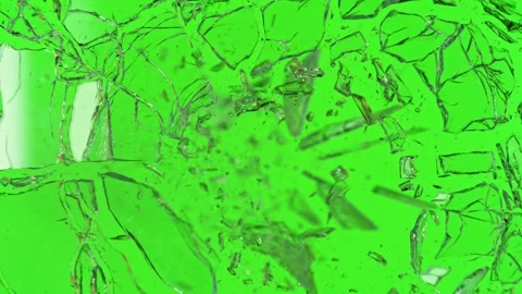 Super slow motion of shattering glass against green screen Stock Footage 288450087