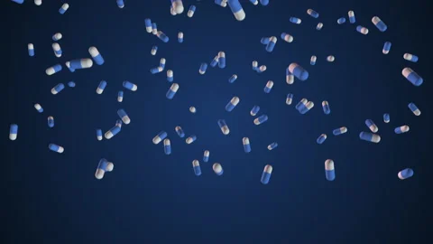 Super slow-motion shooting of blue - and-white pills falling into the bottom. Lo Stock Footage 156433763