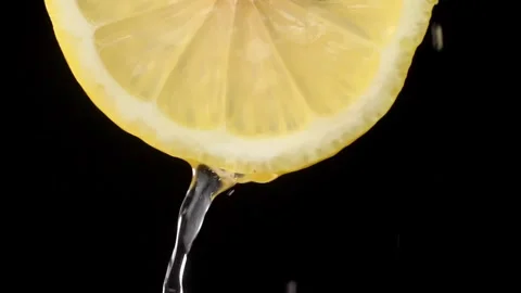 Super slow motion shooting of sliced lemon slices with splashes of water, Stock Footage 248896649