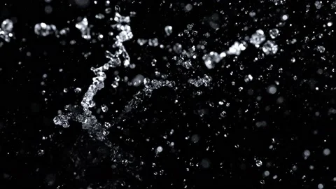 Super Slow Motion Shot of Abstract Water Splash Isolated on Black Background at Stock Footage