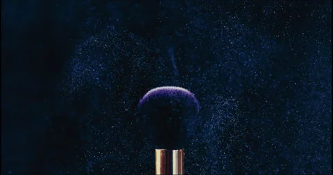 Super Slow Motion Shot of Blue Makeup Powder Falling from Facial Brush Stock Footage 245273755