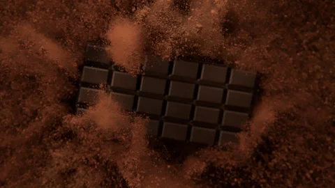 Super Slow Motion Shot of Chocolate Bar and Cocoa Powder Exploded Towards Camera Stock Footage 303283844