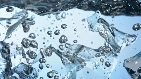 Super Slow Motion Shot of Clear Ice Cubes Falling into Water at 1000fps. Video stock 341833881