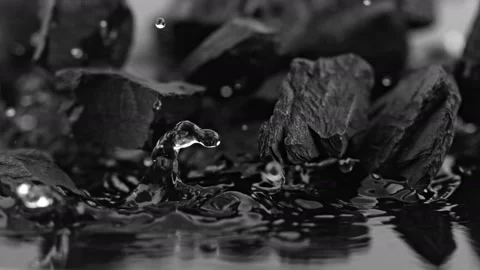 Super Slow Motion Shot of Coal Falling into Water at 1000 fps. Stock Footage 139691599