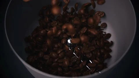 Super Slow Motion Shot of Coffee Beams Exploding in Coffee Grinder on Studio Stock Footage 230100221