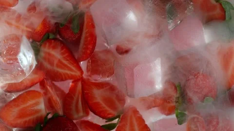 Super Slow Motion Shot of Cold Strawberry and Ice Cubes Background at 1000fps. Stock Footage 338331375