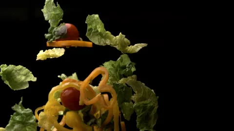 Super Slow Motion Shot of Diced Vegetables Falling Against Black Background Stock Footage 270408706