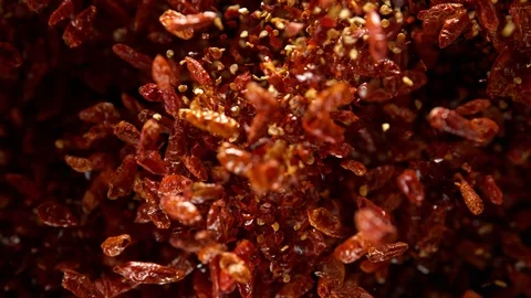 Super Slow Motion Shot of Dried Red Chili peppers Explosion on Black Background Stock Footage 120804493