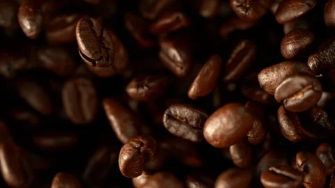 Super Slow Motion Shot of Exploding Premium Coffee Beans Towards the Camera at 스톡 동영상 115067159