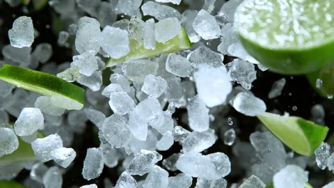 Super Slow Motion Shot of Exploding Crushed Ice, Lime and Mint Towards Camera at Stock Footage 119950179