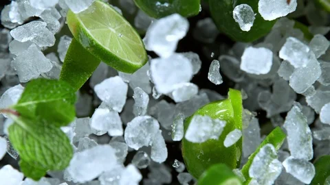 Super Slow Motion Shot of Exploding Crushed Ice, Lime and Mint Towards Camera at Stock Footage 120007738