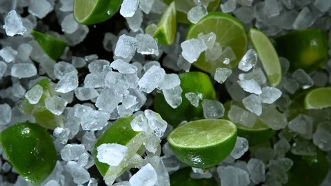 Super Slow Motion Shot of Exploding Crushed Ice and Lime Towards Camera at Stock Footage 120303189