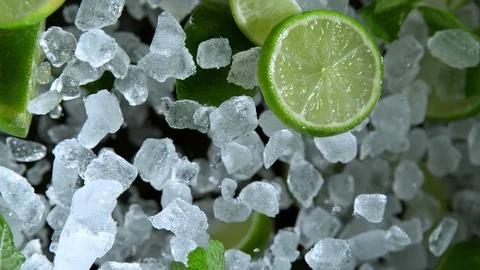 Super Slow Motion Shot of Exploding Crushed Ice, Lime and Mint Towards Camera at Stock Footage 120372039