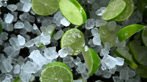 Super Slow Motion Shot of Exploding Crushed Ice and Lime Towards Camera at Stock Footage 120516012