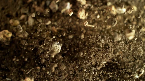 Super Slow Motion Shot of Exploding Soil with Rocks Towards Camera at 1000fps. Stock Footage 318137633