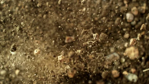 Super Slow Motion Shot of Exploding Soil with Rocks Towards Camera at 1000fps. Stock Footage 318214258