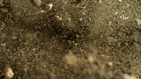Super Slow Motion Shot of Exploding Soil with Rocks Towards Camera at 1000fps. Stock Footage 318514025