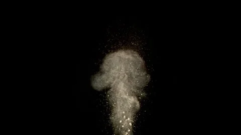 Super Slow Motion Shot of Exploding Soil,Rocks and Dust Isolated on Black at Stock Footage 318952436