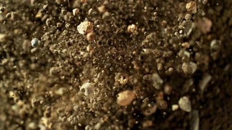 Super Slow Motion Shot of Exploding Soil with Rocks Towards Camera at 1000fps. Stock Footage 318971036