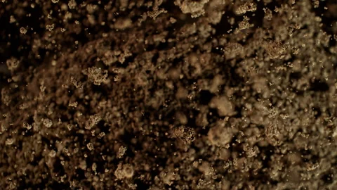 Super Slow Motion Shot of Exploding Soil Towards Camera at 1000fps. Stock Footage 326368485