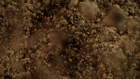 Super Slow Motion Shot of Exploding Soil Towards Camera at 1000fps. Stock Footage 331949073