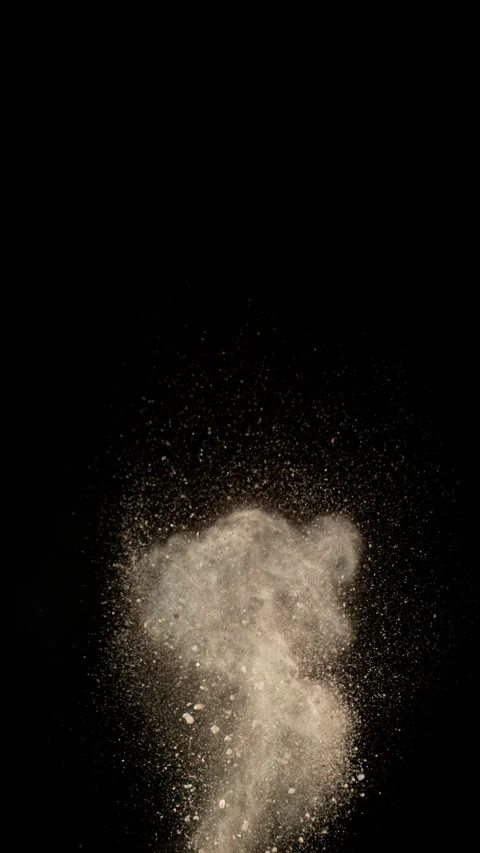 Super Slow Motion Shot of Exploding Soil, Rocks and Dust Isolated on Black at Stock Footage 334032304